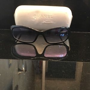 Black CHANEL sunglasses with blue lenses